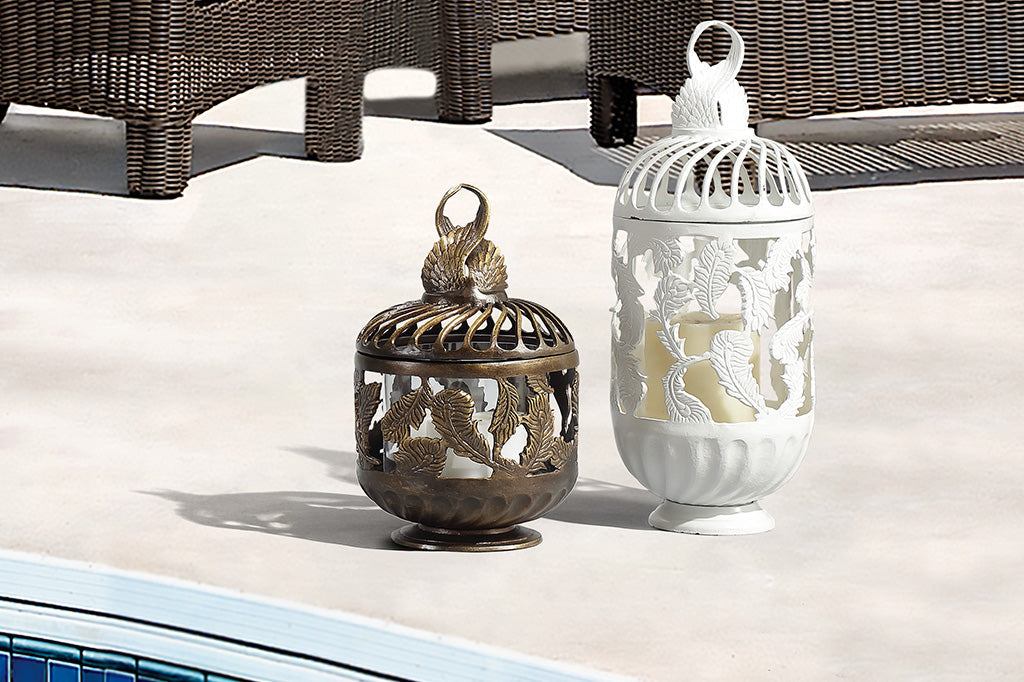 Bronze short lantern and white tall lantern side by side on pool deck
#color_bronze