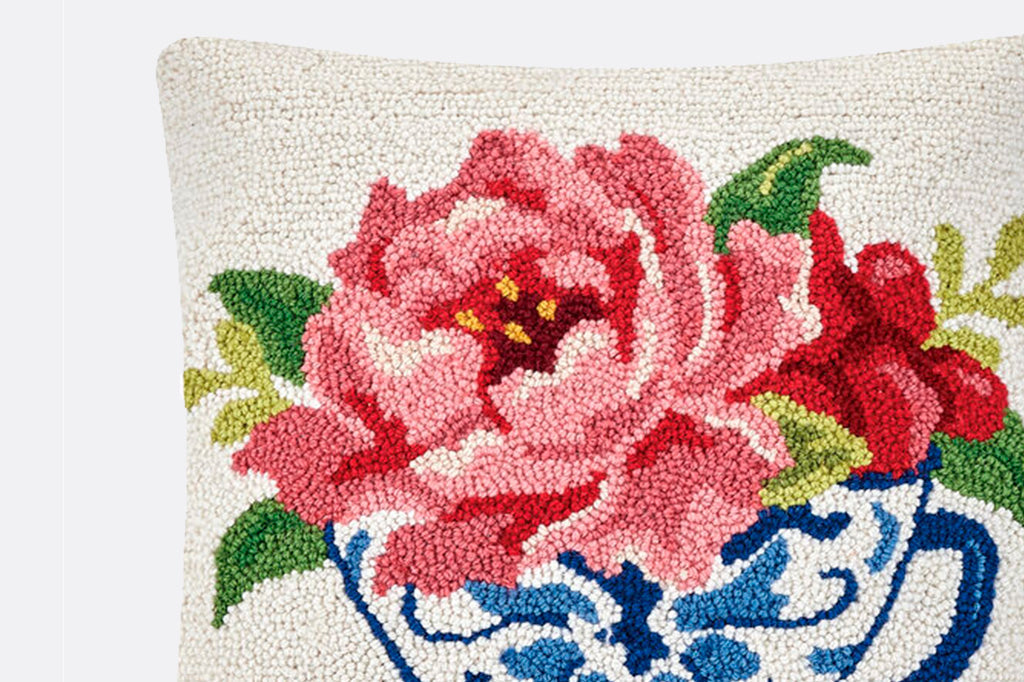 Hooked wool pillow, blue chinoiserie teacup with pink peony and foliage atop teacup