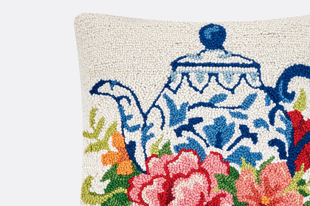 hooked wool with chinoiserie patterned teapot surrounded by roses and foliage