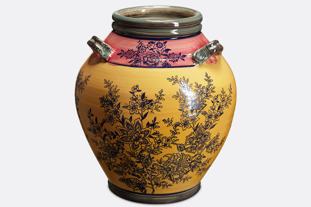 Melone e Oro Jar has 3 handles, and multiple regions of glaze in blue, rose, and yellow 