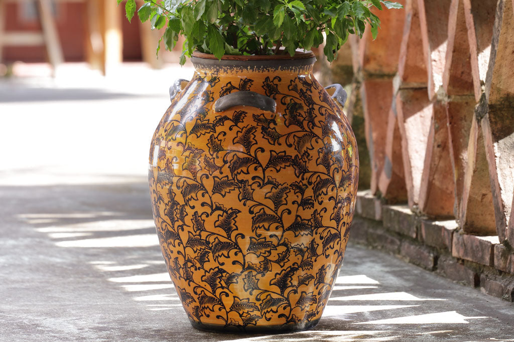view of 3 handled Cachi Jar in outdoor setting
