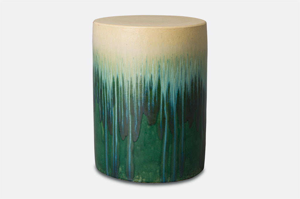 ceramic stool with dripped style glazing in ombre going from cream-aqua-green