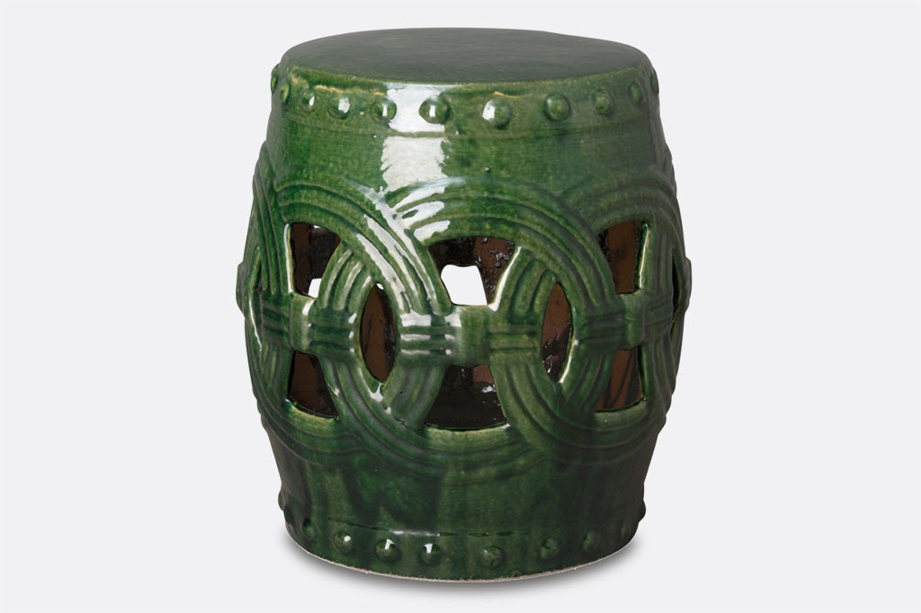 green ceramic garden stool with medallian interlocking fretwork motif