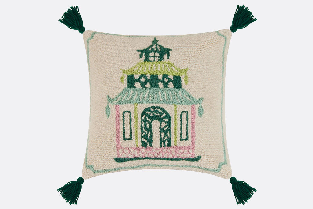 In cream and pastel, a modern take on asian pagoda of green, mint, and pink. Hooked wool pillow with vibrant green tassels.