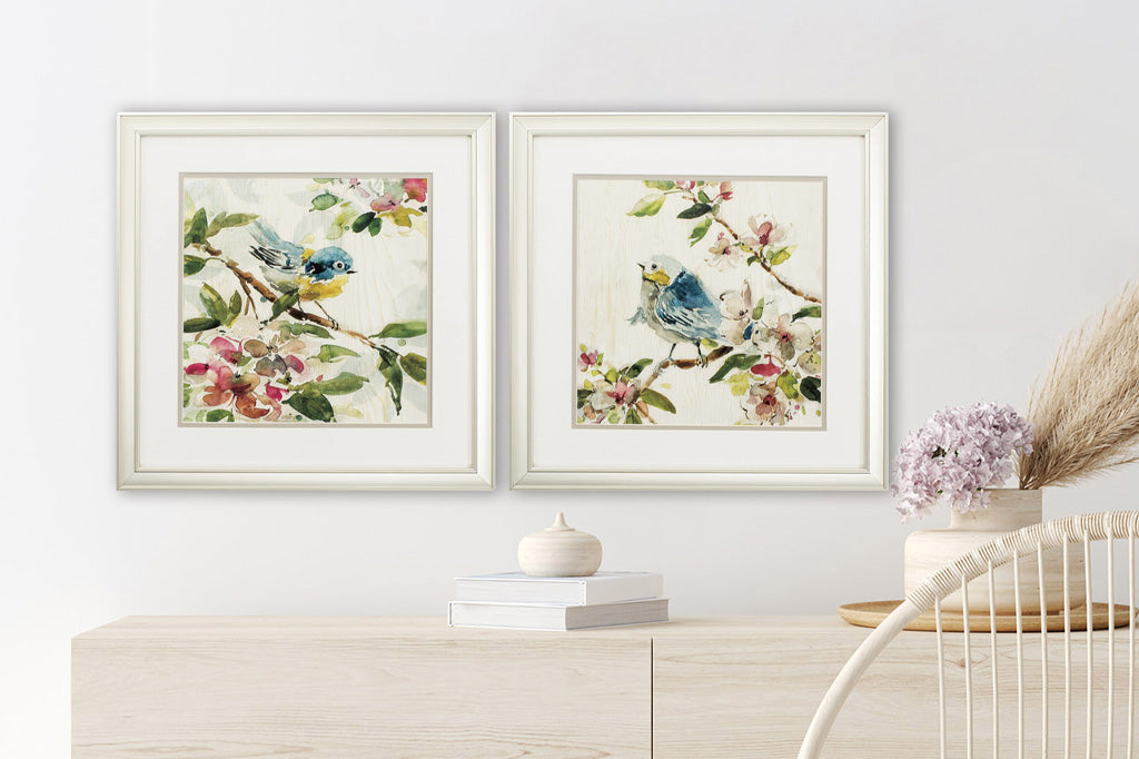Matching framed art with white frames shows watercolor effect birds on branches