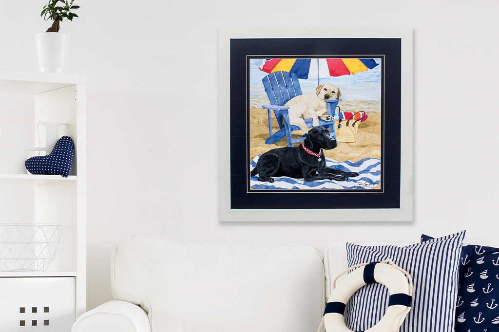 framed art of two dogs on the beach shown in beach house