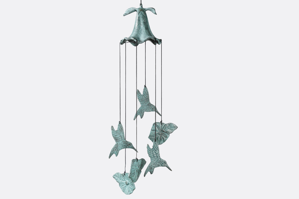 cast metal windchime with hummingbird and flower charms suspended from nylon string