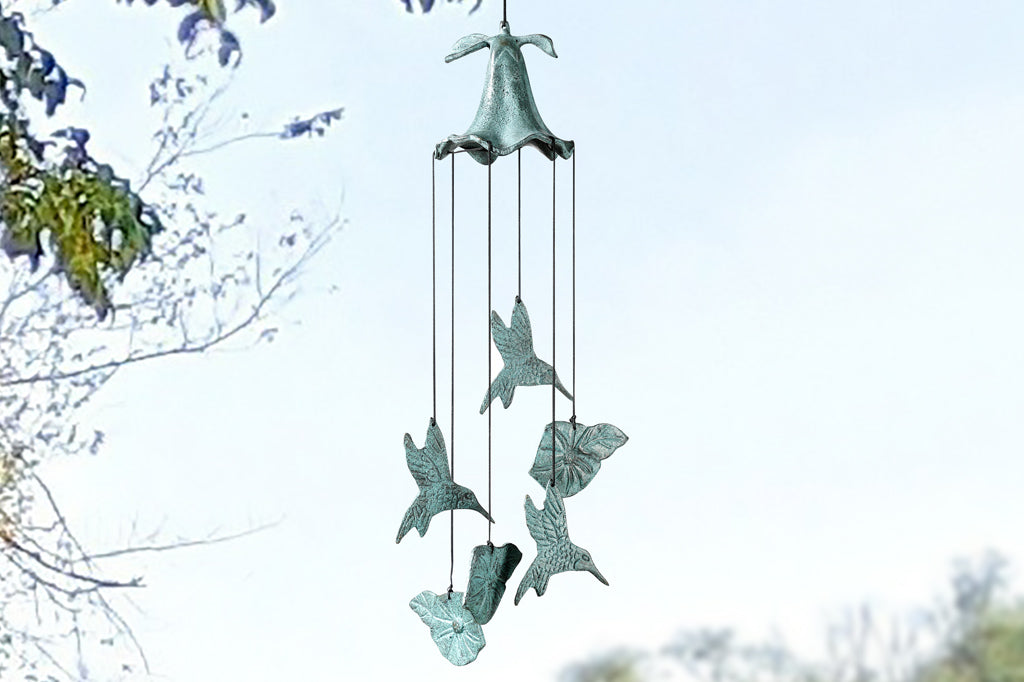 cast metal windchime with hummingbird and flower charms suspended from nylon string