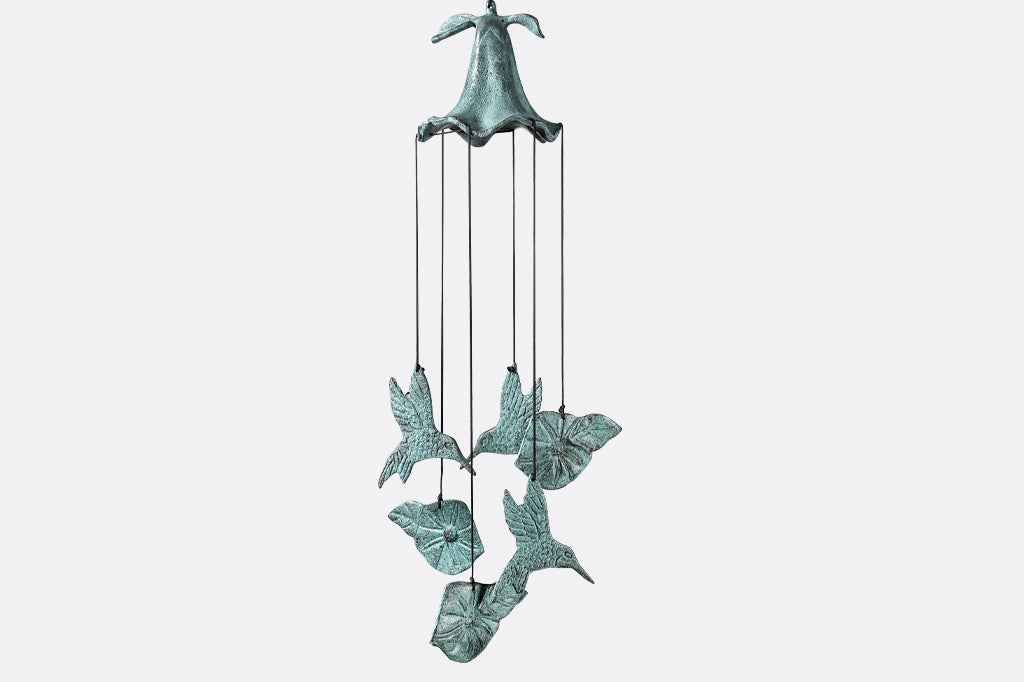 cast metal windchime with hummingbird and flower charms suspended from nylon string