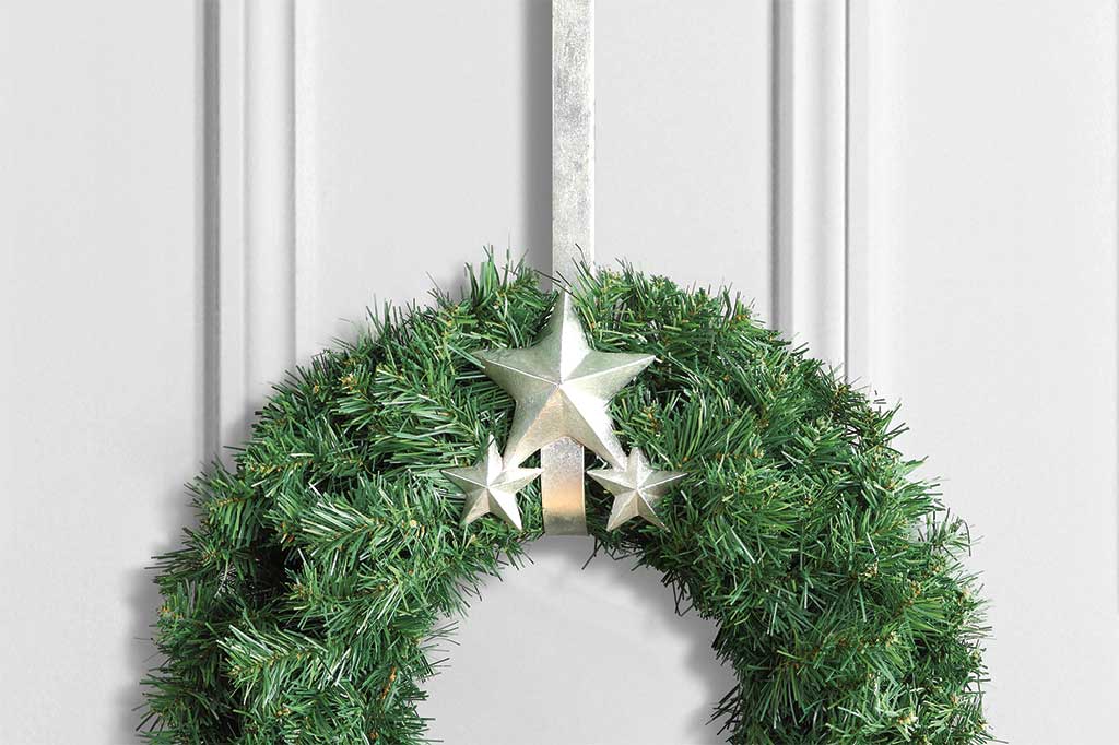 Sliver three star wreath hanger, holding green wreath over door