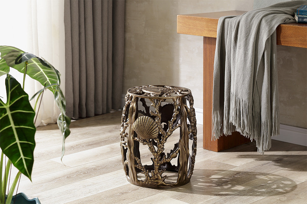 bronze coastal tide pool theme on a sculptural stool in living room that holds a console table and houseplant
#color_bronze