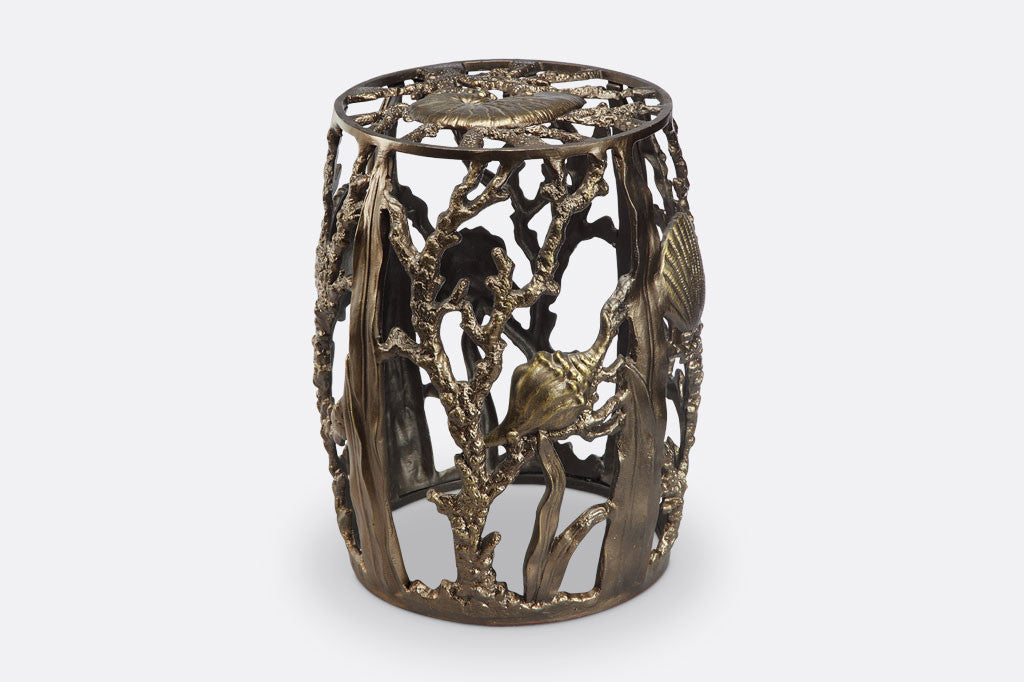 Under The Sea Garden Stool in bronze finish, shows nautilus seashell surrounded by kelp and coral designs
#color_bronze