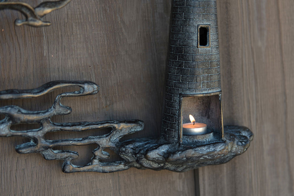 close up view of the candle holder on the lighthouse Votive Wall Plaque