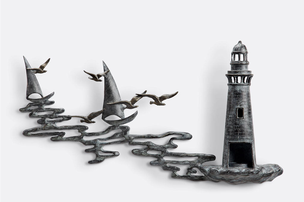 Wall art Votive holder cast metal sculpture of Lighthouse by the sea with 2 sail boats