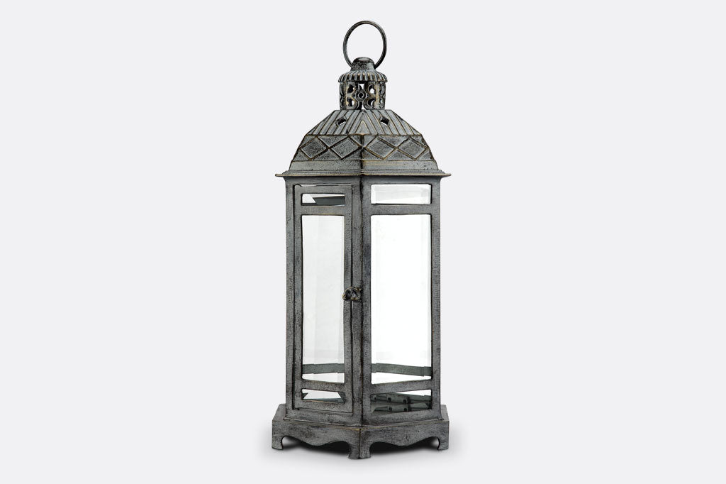 Sea Ranch Lantern alternating view of lantern. Sea Ranch Lantern in zinc finish with architectural style roof and 6 panes of glass