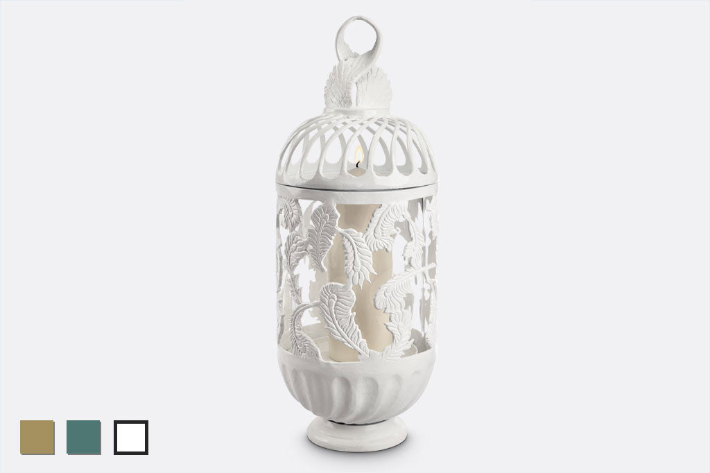 white cast metal swirling feather tall lantern with pillar candle inside
#color_white