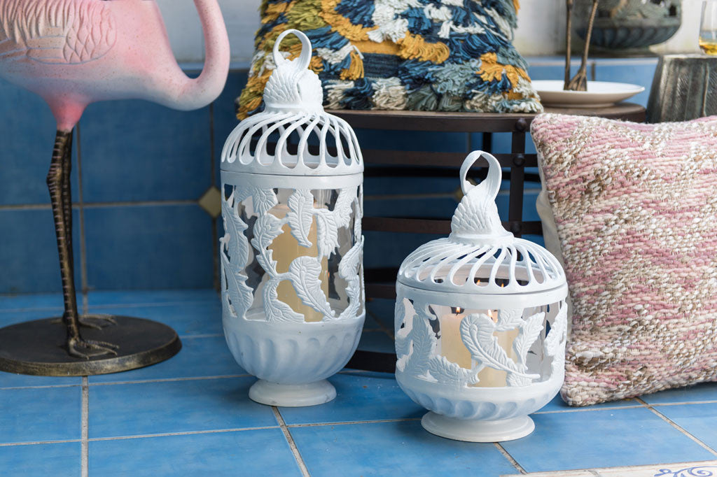 tall and short white cast metal swirling feather lantern
#color_white