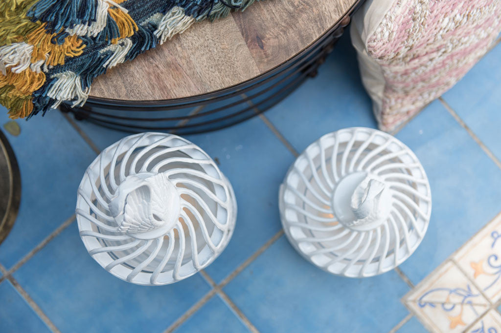 Top down view of swirling feather lanterns
#color_white