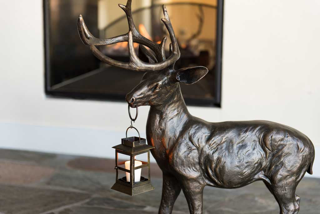 close up on details of sculpt for cast metal deer with lantern