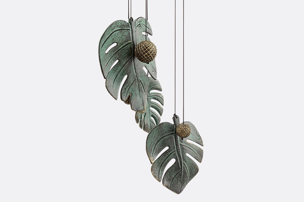 Detailed view of cast metal monstera leaf, gray with blue patina coloring