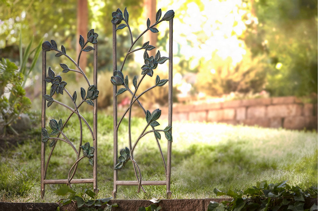 Magnolias Garden Trellis, short and tall, in a garden setting above stone wall