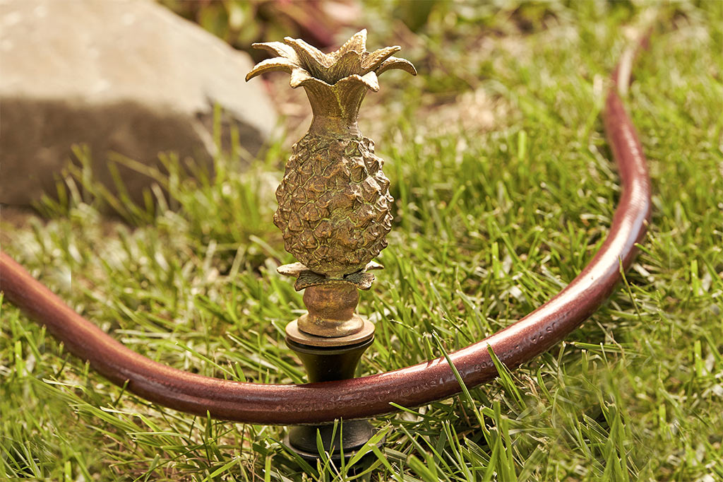cast metal gold pineapple hose guard