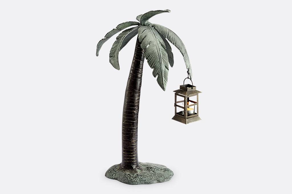 votive candle lantern shaped like a free-standing palm tree, slightly curved to one side