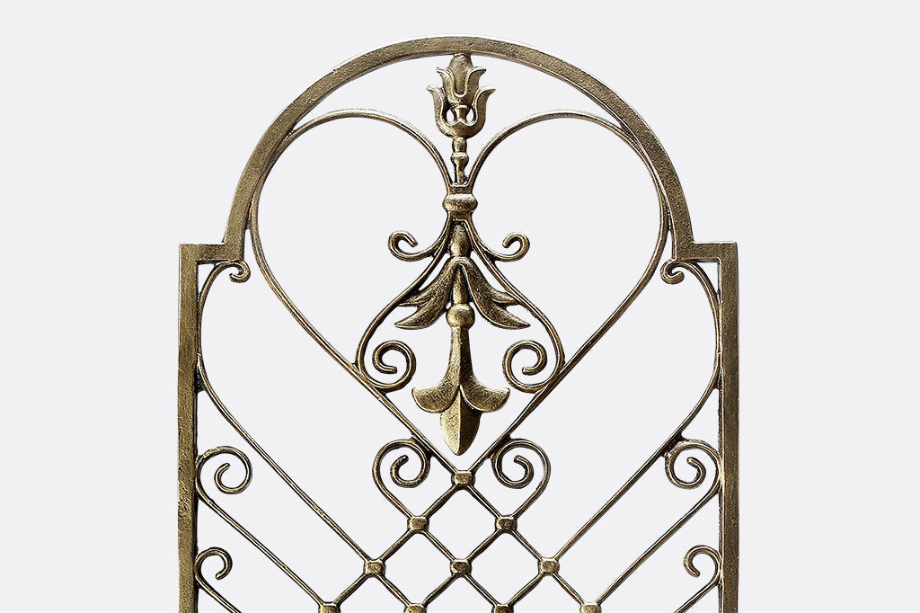 garden trellis in bronze with fleur de Lys and scrollwork motifs