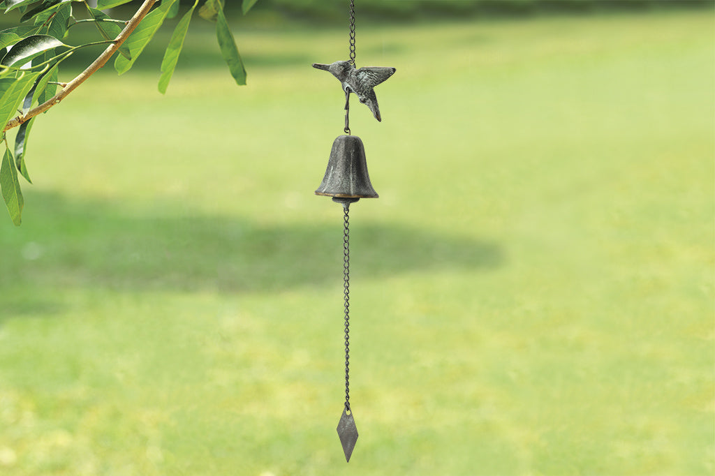 brass wind bell with bird motif and diamond pendulum