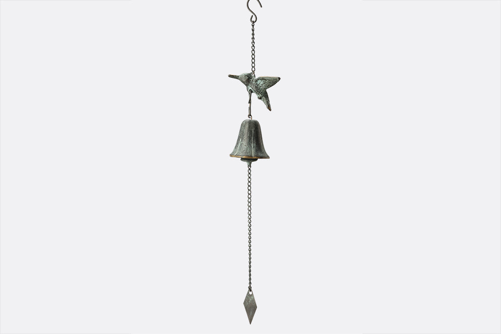 brass wind bell with bird motif and diamond pendulum