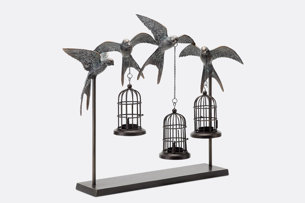 hanging lantern table sculpture with 4 sculpted swallows holding 3 candle birdcages