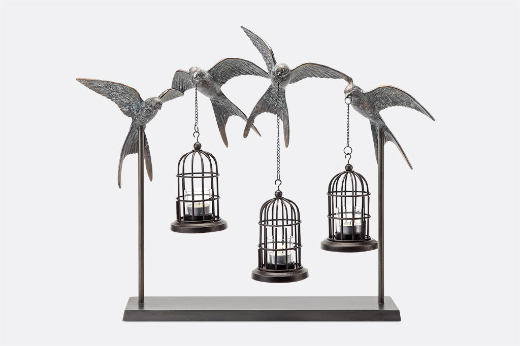 hanging lantern table sculpture with 4 sculpted swallows holding 3 candle birdcages