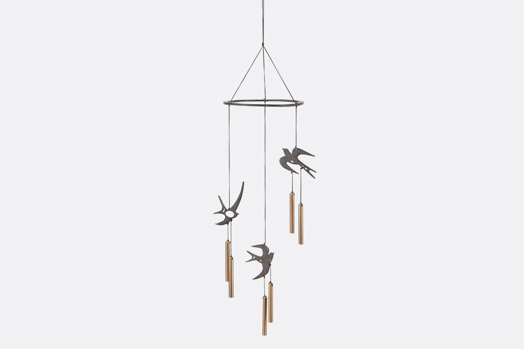 Circular Ring has three swallows and chimes suspended from it as wind art