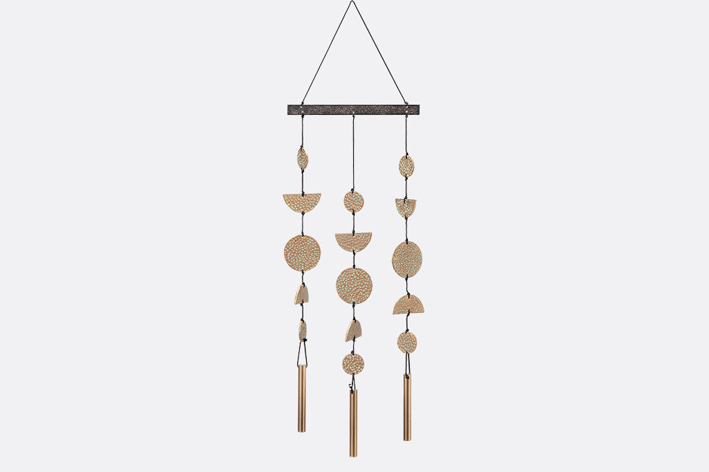 cast metal wind art containing geometric circles and half circles.