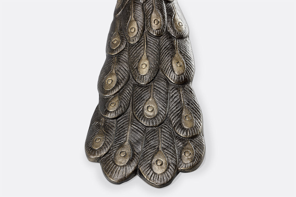 detailed cast metal peacock feather