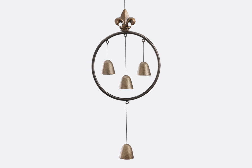wind bells in circle with fleur-de-lys motif