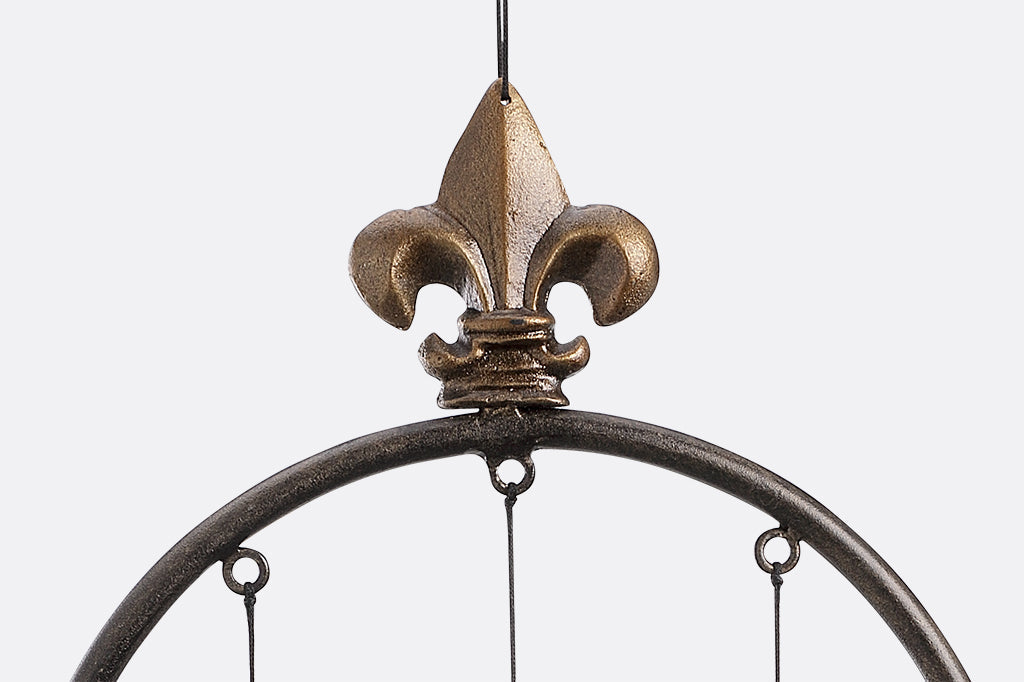 fleur-de-lys motif shown on top of wind art hoop
