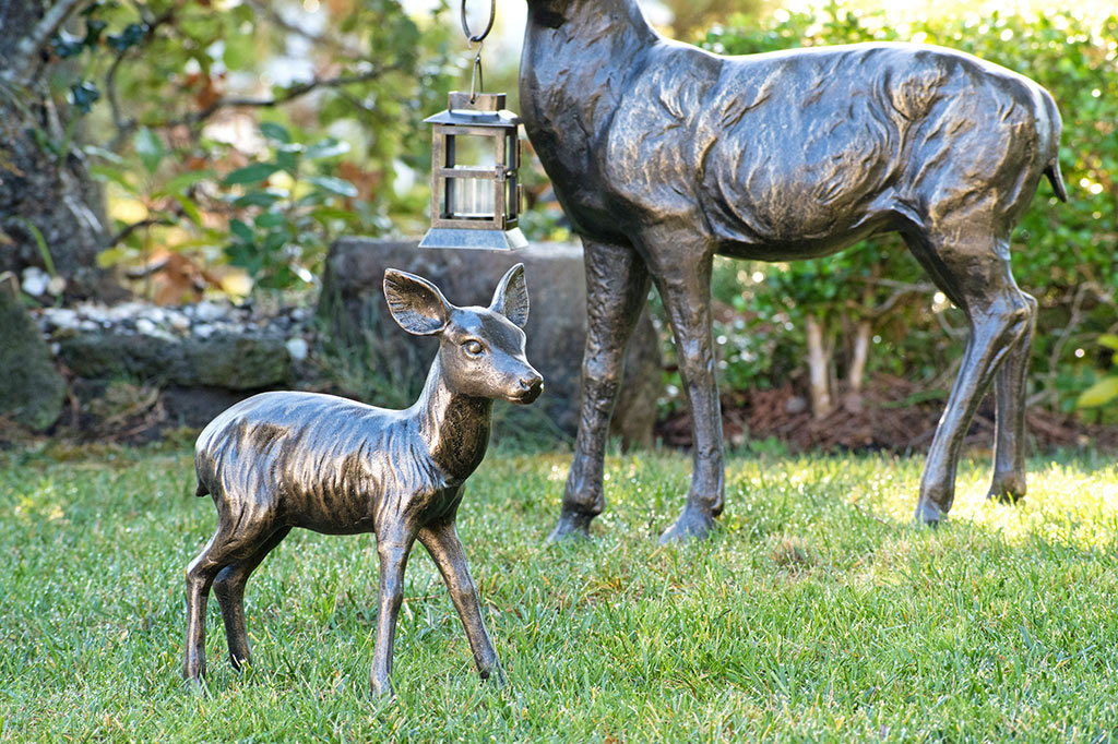 cats metal fawn sculpture on grass