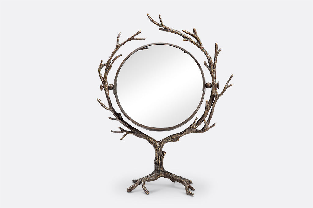 tree and branch theme for a two-sided vanity mirror