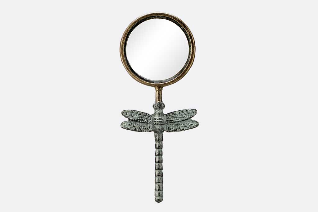 cast metal frame for hand held maginifying glass with decorative dragonfly handle