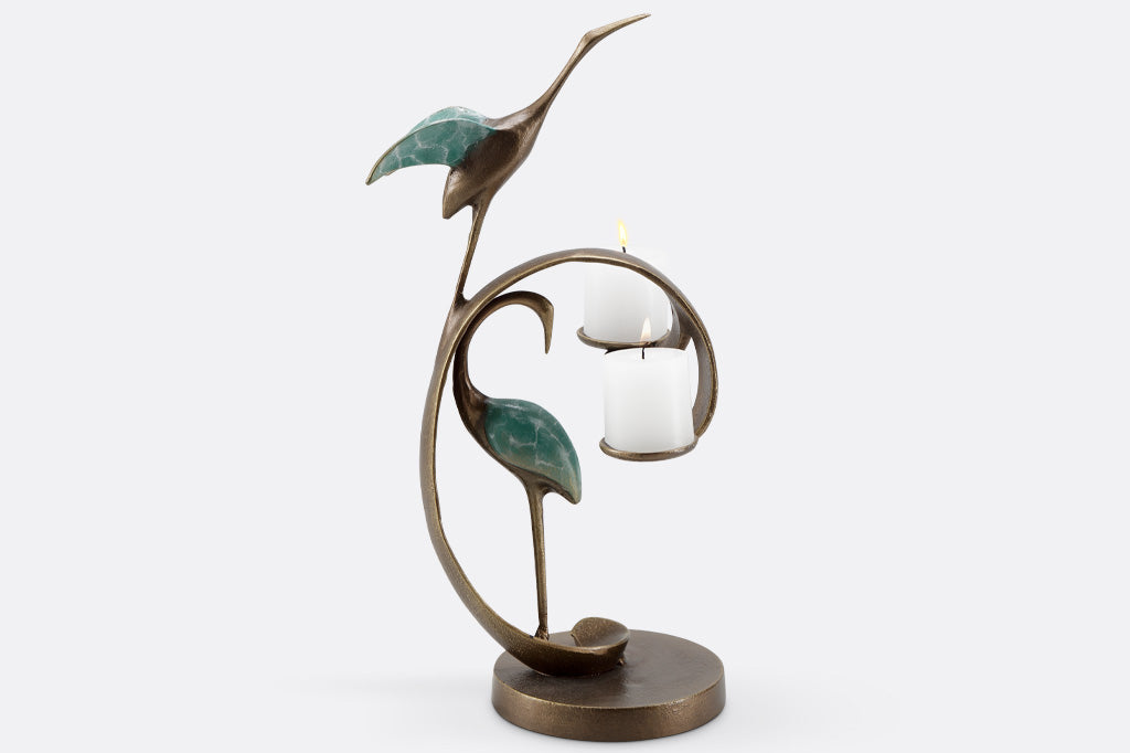 home decor mini sculpture of two cranes with verdi patina - shown with base and swooping curl that holds two tea lights