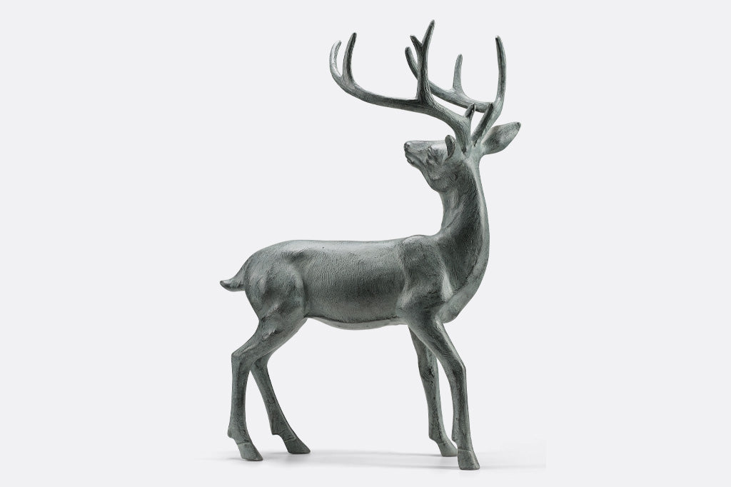 back side of cast metal deer with antler sculpture