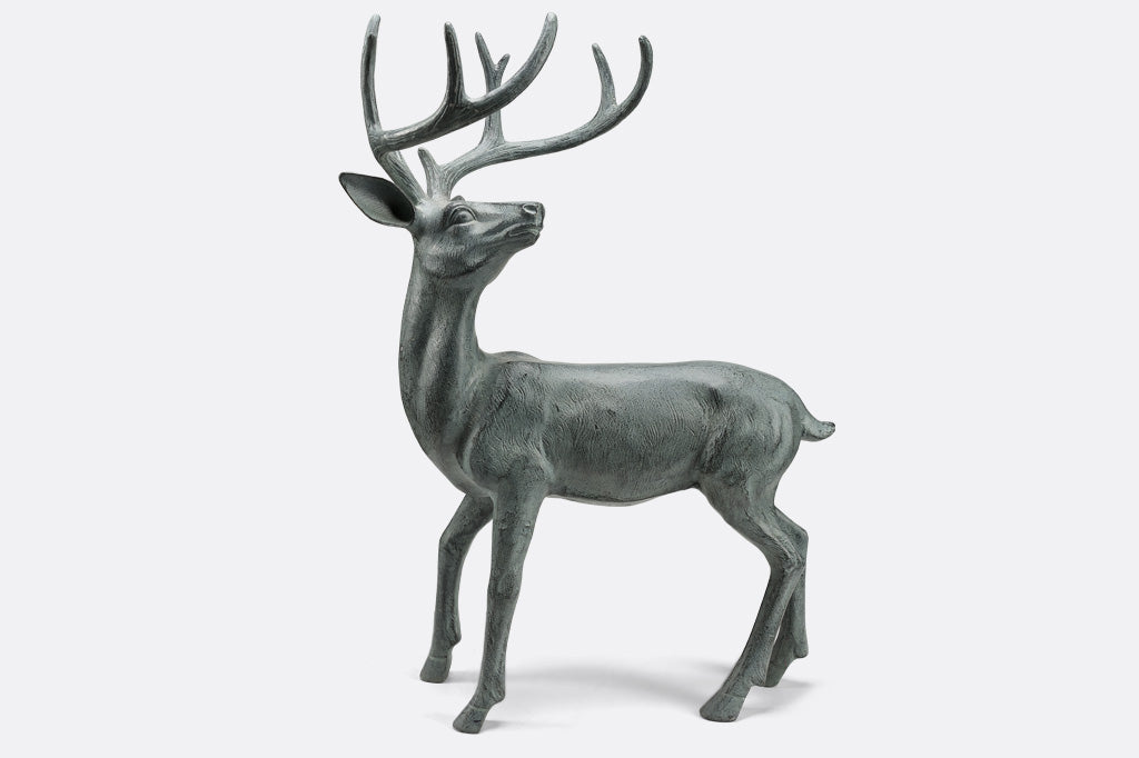 view of cast metal deer sculpture looking over shoulder