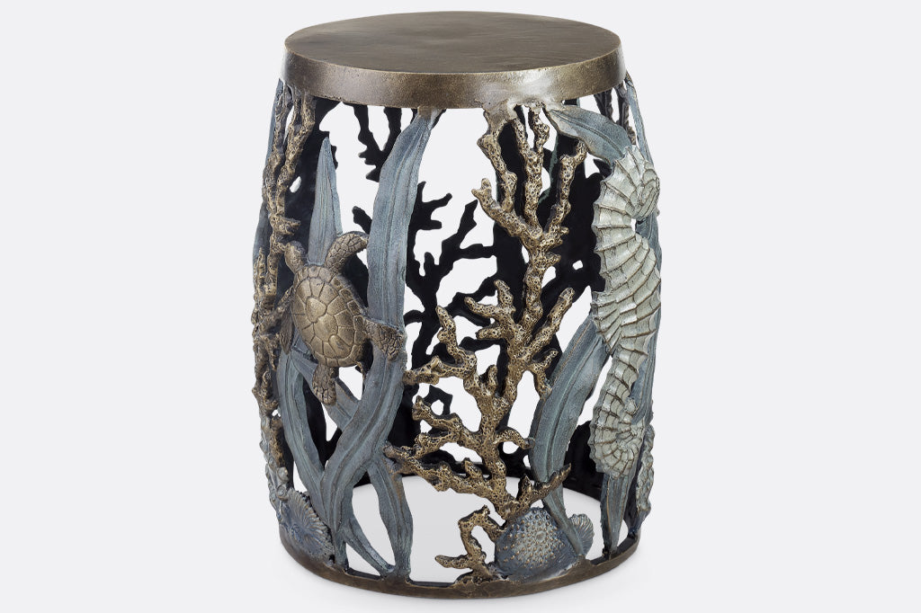 cast metal garden stool with solid seat, design of tidal animals: kelp, coral, turtle, seahorse in various finishes of green, blue, bronze, and zinc