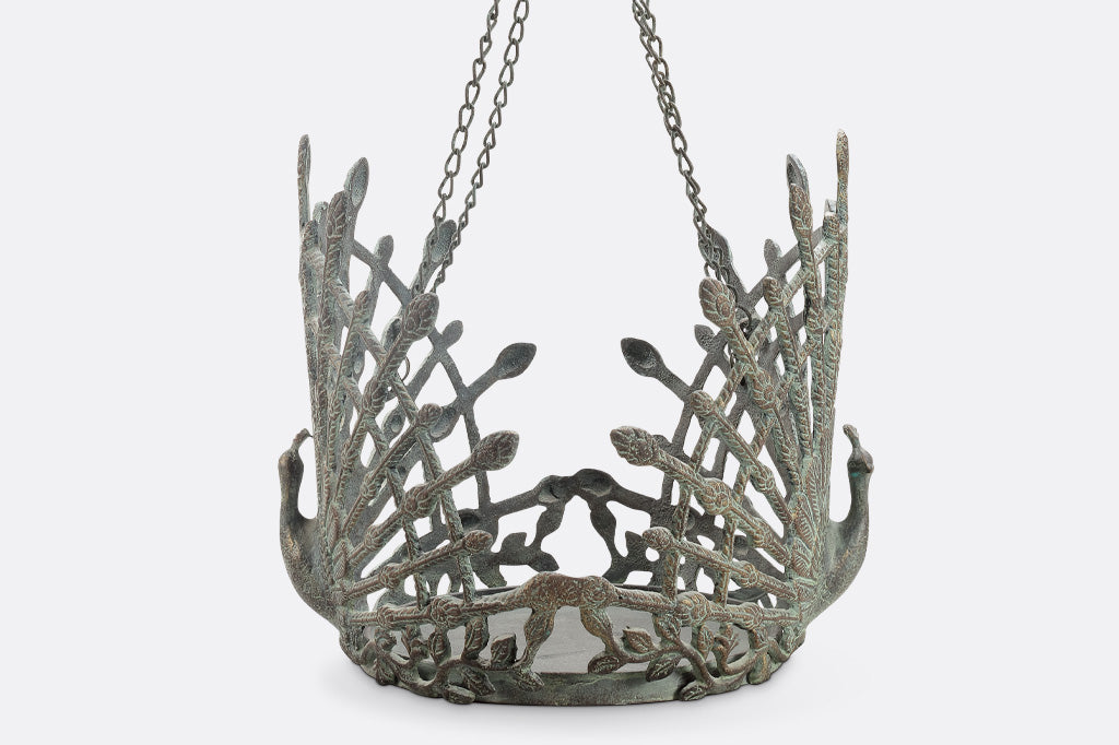 cast metal hanging pot holder with two peacocks in full relief sculpting with outspread feathers