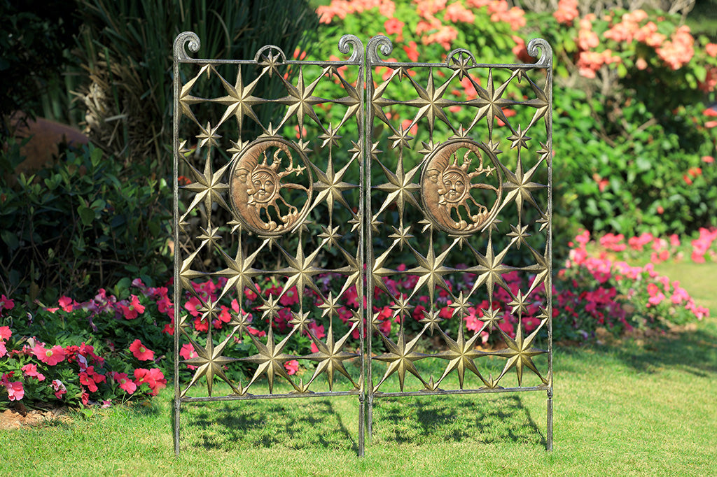 Pair of garden trellises featuring stars and celestial themes - shown in garden
