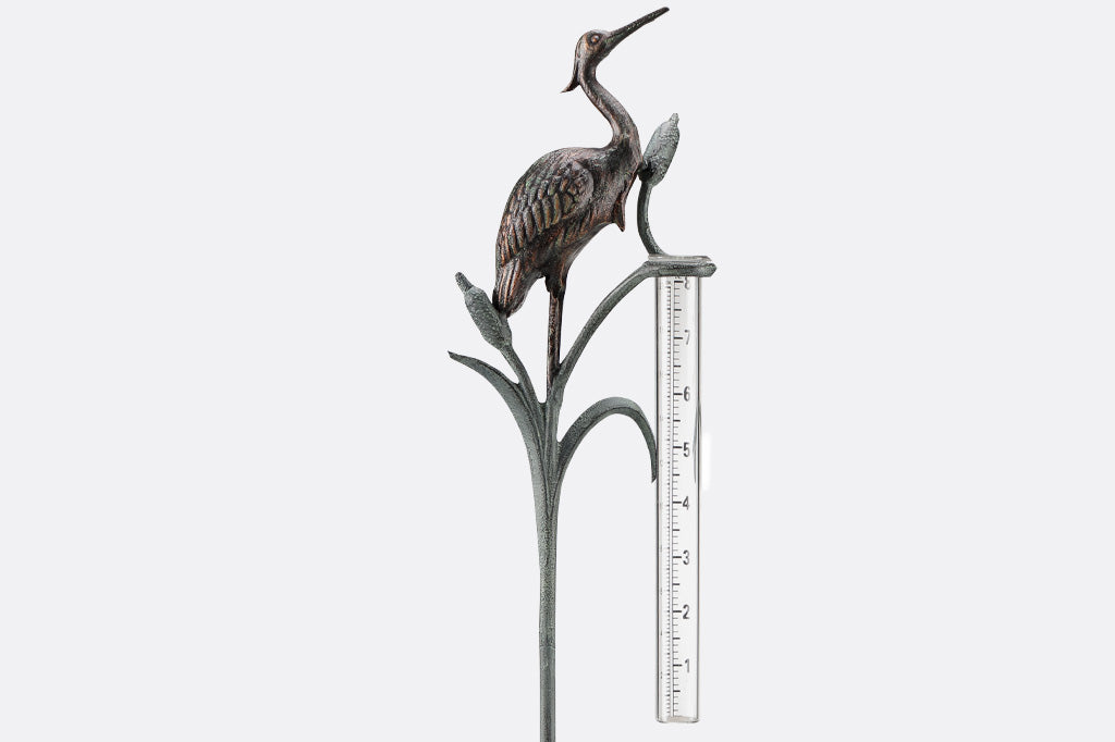 Metal heron and cattails rain watcher