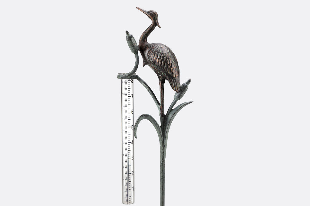 Metal heron and cattails rain watcher