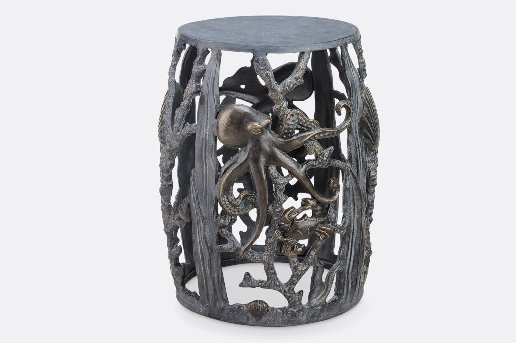 cast metal sea creature, octopus, crab, and shell detailing on stool