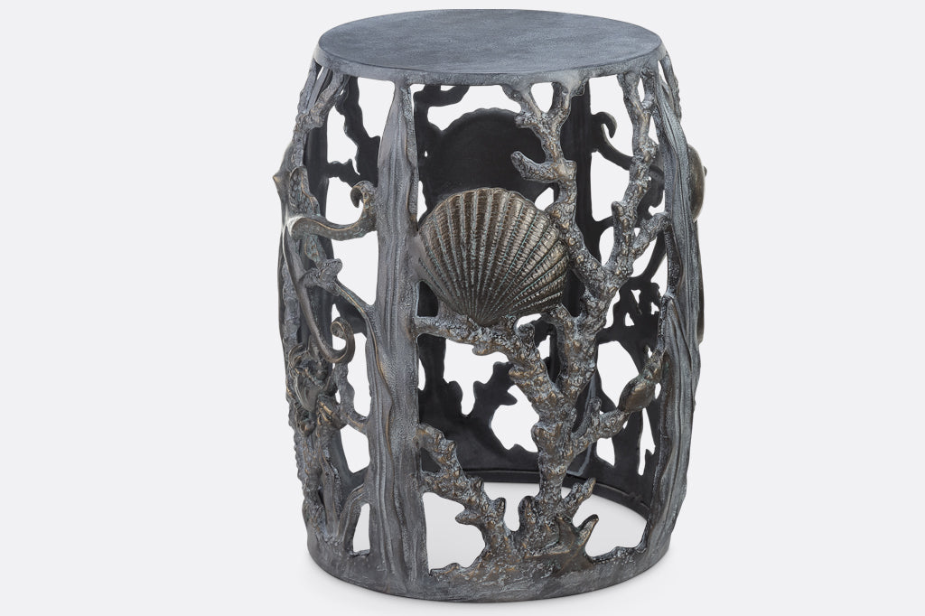 cast metal sea creature, octopus, crab, and shell detailing on stool